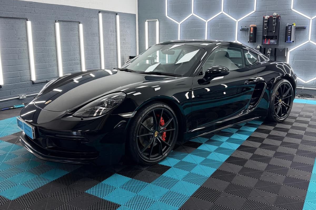 Ceramic maintenance detail on a black Porsche